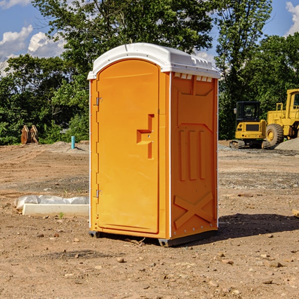 what is the cost difference between standard and deluxe porta potty rentals in Finley